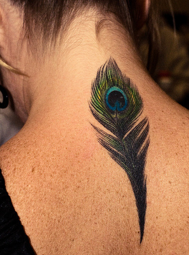 i really want to get a tattoo of a peacock feather. 