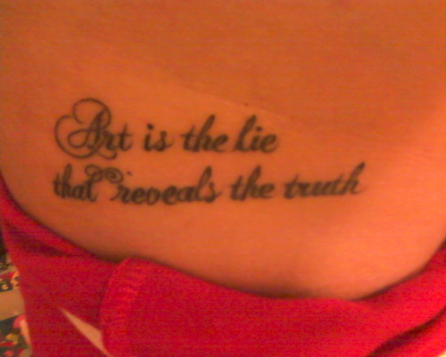 Tattoo is a quote from Picasso on the side of my waist 