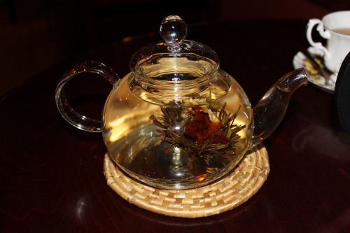 bohemea:  Flowering Tea, February 14th 2010 (via bohemea) suicideblonde & I had this yummy & pretty tea at a tea lounge last month. At the cafe, you could choose your own china tea cup & enjoy homemade pastries with your tea. I think the flower was lily & jasmine. It was light & slightly spicy & delicious.