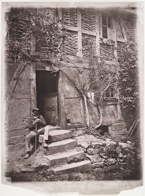 Unknown Artist, German School, [Man Sitting on Steps of House with Socks Hanging on Nearby Vine to Dry], 1880s, Collotype (metmuseum.org)