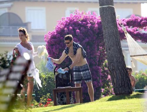 Xabi Alonso and family in Mallorca how cute is little Jon behind the tree