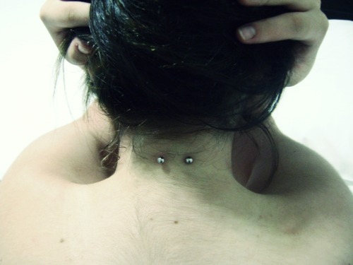 14G nape piercing with surface bar. Took it on January 27, 2010. Submitted