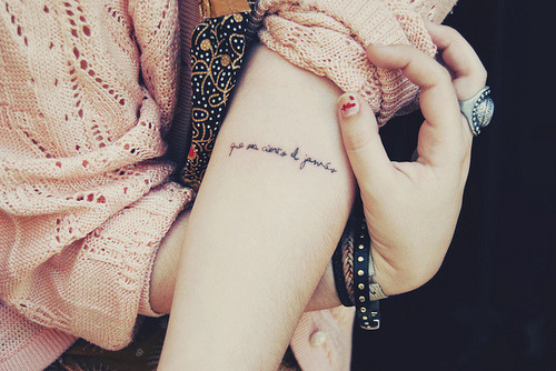arm writing tattoos