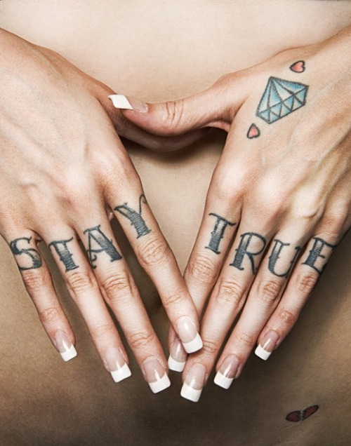 tagged as: stay true. tattoo. finger tats. text. font. nuckle. long. nails.