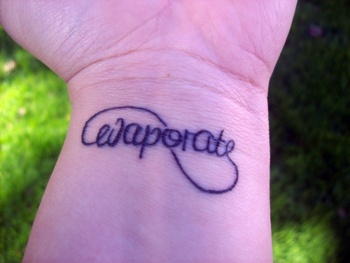 my first tattoo, the infinity symbol with the word “evaporate”, 