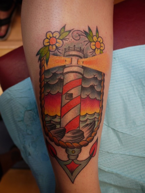 Traditional lighthouse done by Jimmee Schlotterhausen at My Tattoo Shop in 