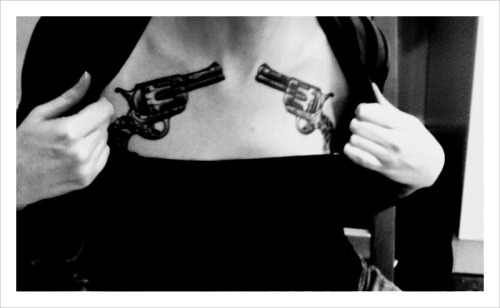 girls with guns and tattoos. Guns tattoo on girls chest