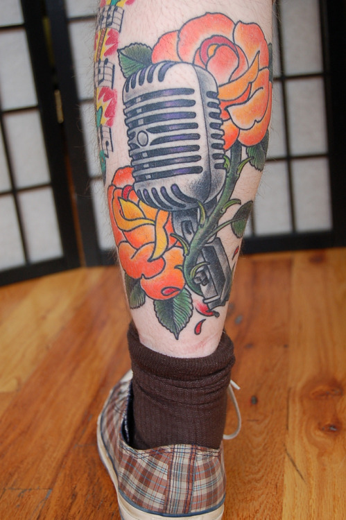 Microphone in roses tattoo