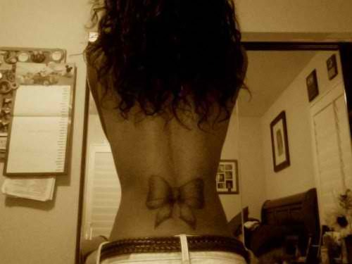 bow tattoo on back of neck. I want a ow tattoo possibly