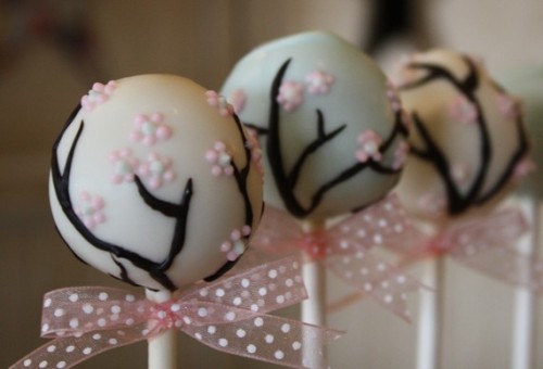 The fine detail on these cherry blossom cake pops is just exquisite