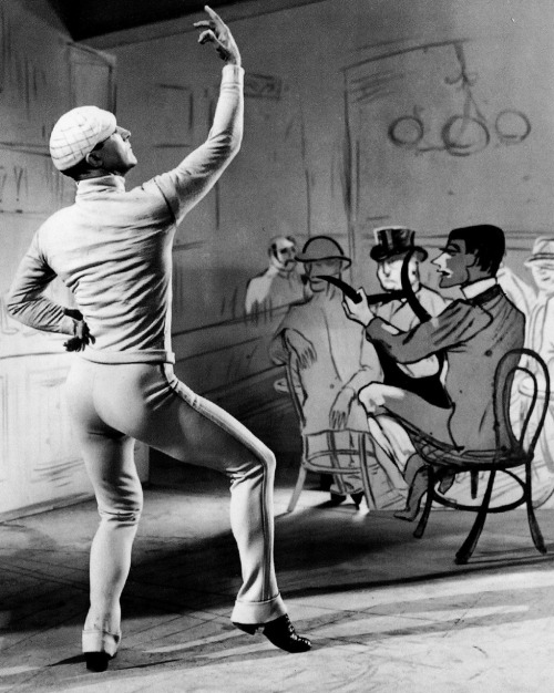 Gene Kelly in An American in Paris (1951, dir. Vincente Minnelli) Art director Preston Ames designed the set in the style of Henri de Toulouse-Lautrec’s painting Chocolat Dancing In Bar Darchille.
(via)