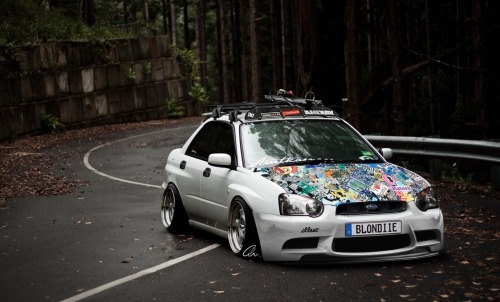 sticker bombed hood stance right subbie