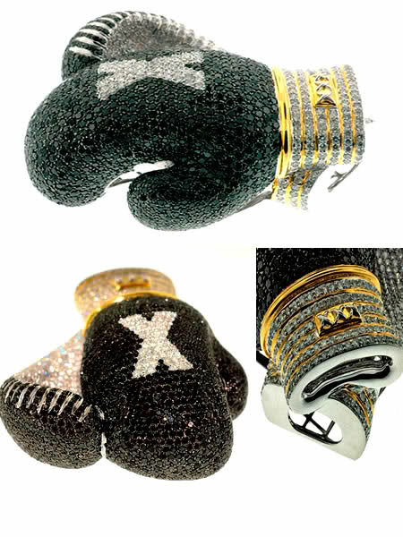 luxuryspy:

These dazzling boxing gloves are priced at US $20,000.00 but,  pricing may vary owing to the customization and market prices.They are  all about sparkling white and black diamonds. All iced out in front and  back, the diamond-encrusted gloves are approximately 3 inches high by  2.5 inches wide, with diamond clarity of 35 cttw of black diamonds and  10 cttw of white. Moreover, about 70-80 grams of 10k gold is also used.  The product can be customized and is available in other colors and  sizes.

Now that&#8217;s authentic