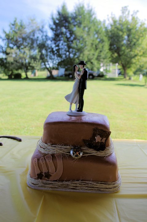 Westernthemed wedding cake for cute little backyard wedding The topper 