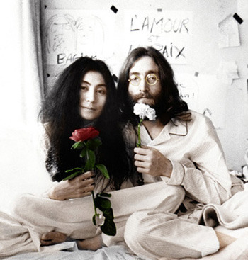 Yoko Ono with John Lennon in bed