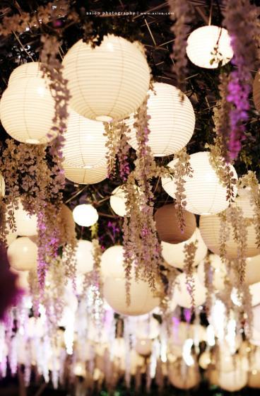 Reception decor hanging lanterns and wisteria via Rani