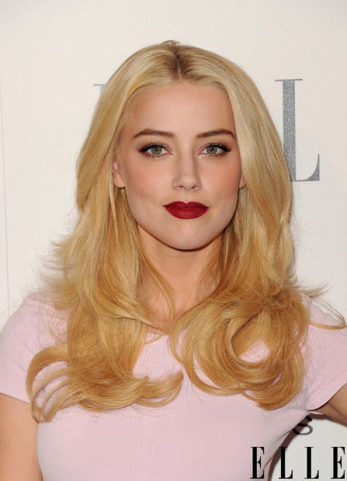 Scarlet Fever Amber Heard puts on a dark red lip to pop off a white dress