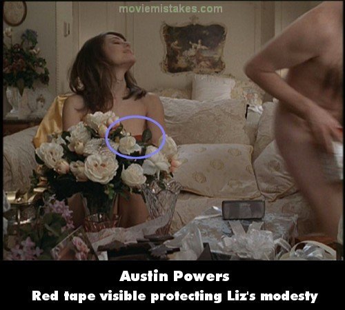  of red duct tape covering Liz Hurley's nipple from behind the flowers