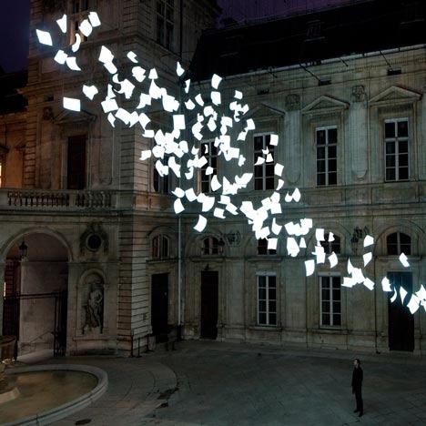 Bourrasque : Paul Cocksedge, Lyon Bourrasque is a sculpture installed in the courtyard of hotel in lyon for the city’s annual festival of lights. the 200 suspended sheets were made from an electrically conductive material that lights up when a current passes through it. london designer paul cocksedge molded each sheet of paper by hand – the paper is the same size as a sheet of a3 paper. (via Blood is the New Black)