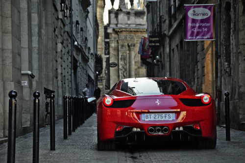 Red Ferrari 458 Italia on a oneway street in Bordeaux France