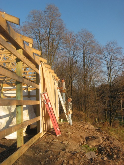 A Catksills Time member assists with construction of the Kortright Creamery