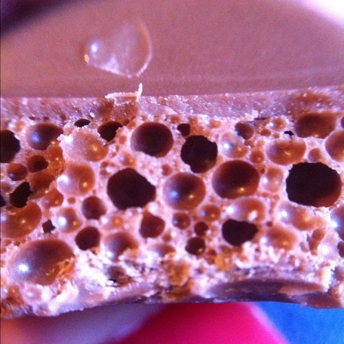 The air bubble deliciousness inside an Aero bar. #chocolate #macro #olloclip  (Taken with instagram)