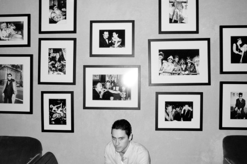 Jared Leto in front of a bunch of awesome photographs.