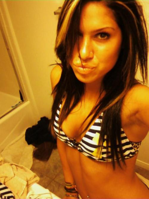 not only is she orange, she’s wearing a push-up bra under her bikini. in a messy bathroom. and making duckface. oh yeah, girl, this whole thing just SCREAMS sexy.